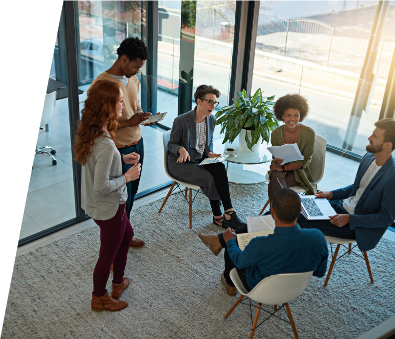 Diverse group of professionals collaborating in bright office space