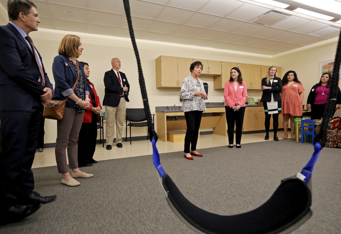 Deputy Assistant Secretary Ruth Ryder (in white) speaks with students and staff at the University of the Incarnate Word.