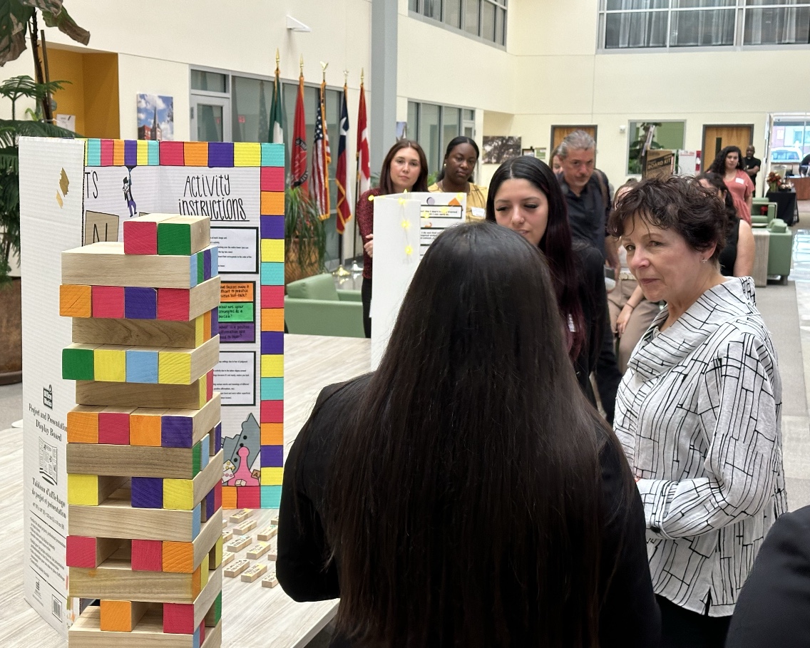 OTD Students from the University of the Incarnate Word present to Deputy Assistant Secretary Ruth Ryder (in white).