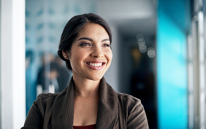 Smiling professional woman looking away from camera