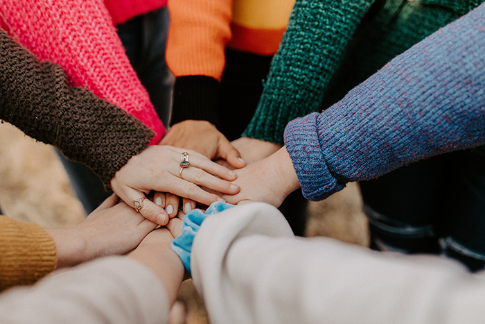 Close up of hands stacked on top of each other