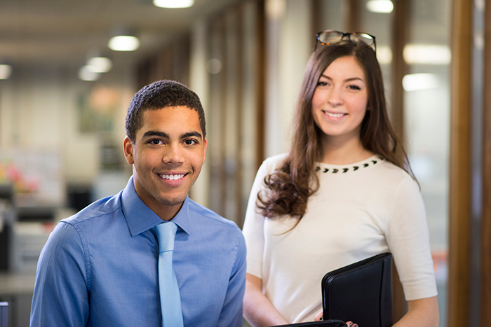 fieldwork students smiling in office setting