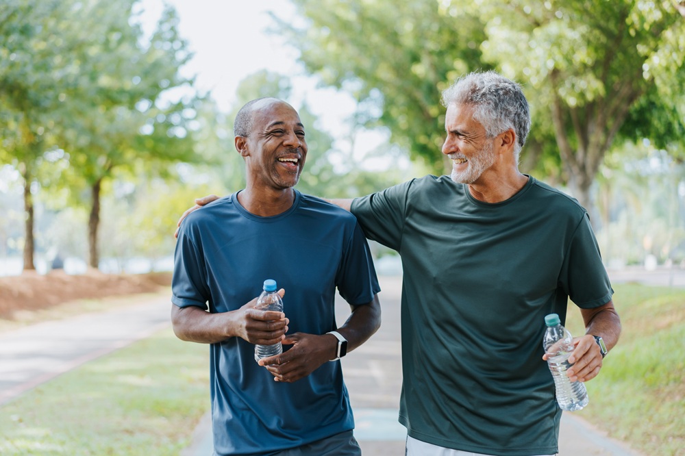 Two men talking and walking outside