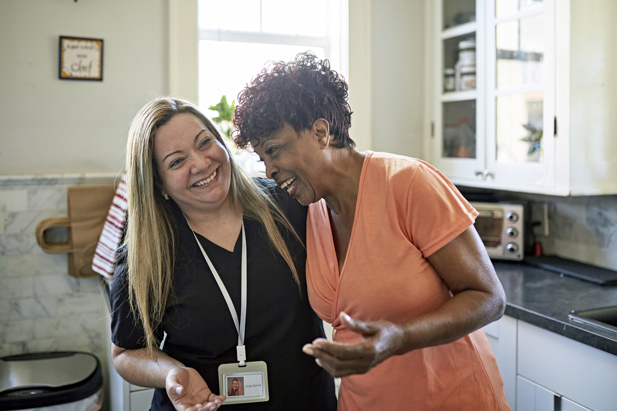 Image of two women talking and smiling
