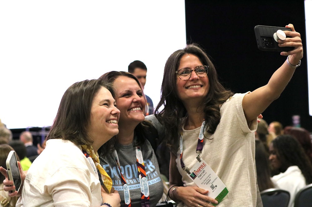 Three people pose together for a selfie at AOTA INSPIRE
