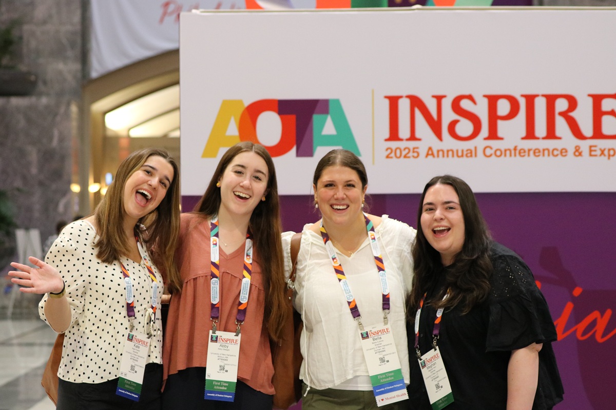 Smiling group poses for photo at INSPIRE