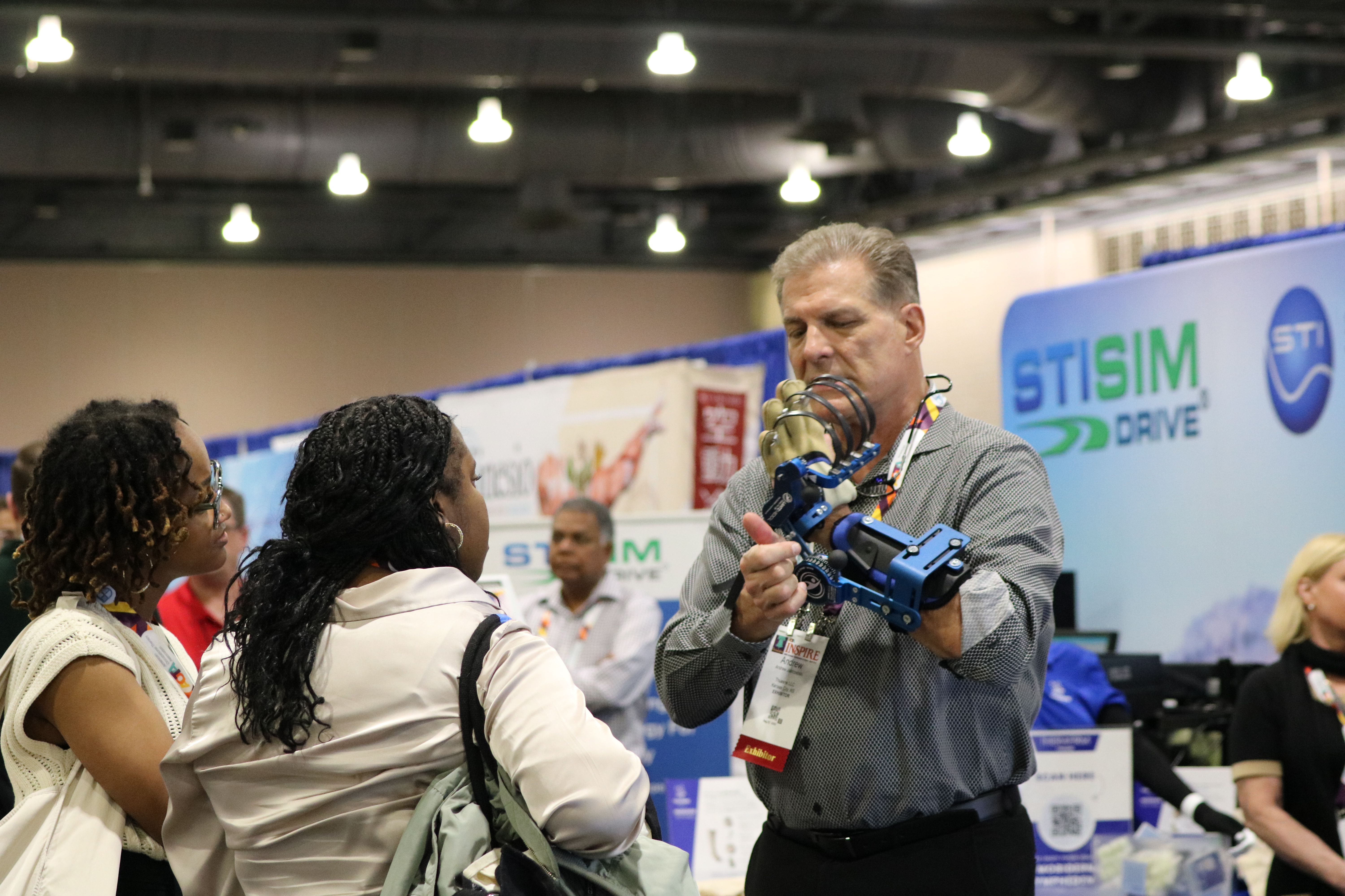 Man exhibiting to event attendees at AOTA INSPIRE 2025