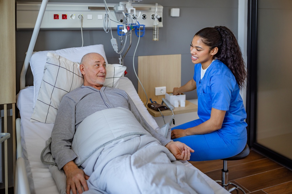 Practitioner works with older adult in hospital setting