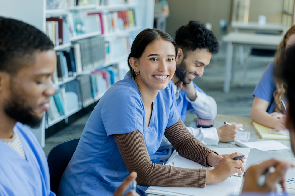 Woman participating in staff meeting in rehabilitation setting