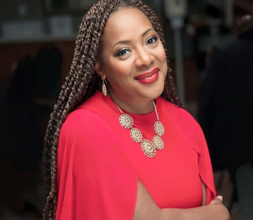 Dale Coffin-Headshot-woman-wearing-red-shirt-necklace-smiling