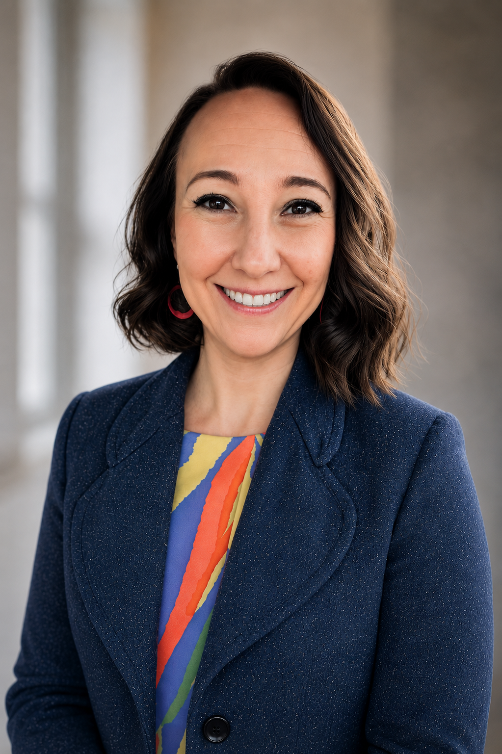 person-smiling-stripe-shirt-blue-blazer