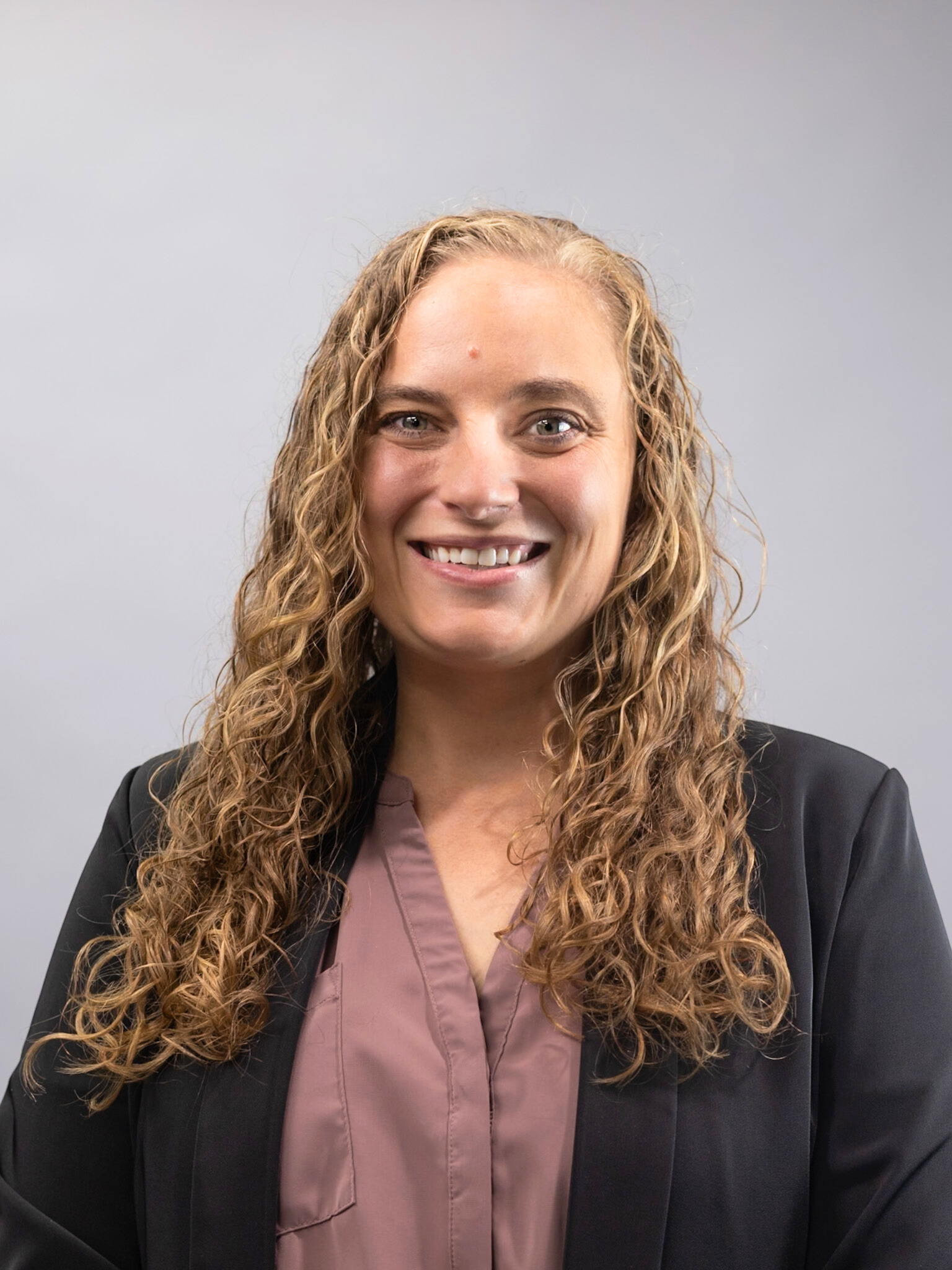 person-smiling-dark-jacket