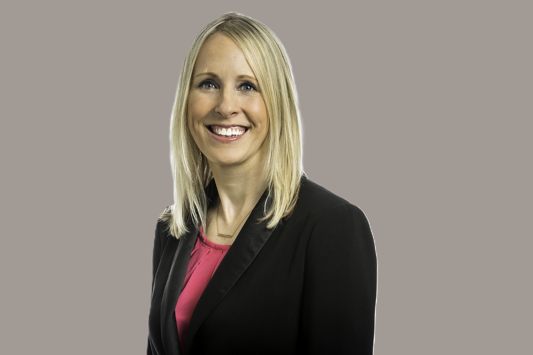 Jennifer Richert smiling-sitting-black-jacket