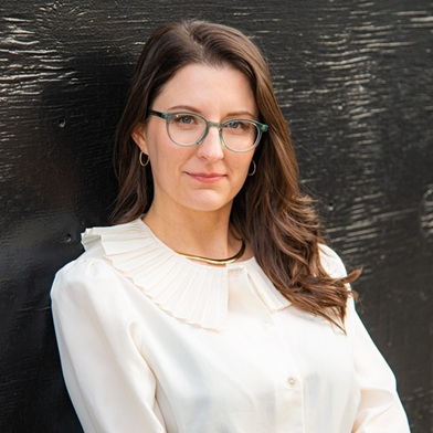 person-standing-white-shirt-glasses