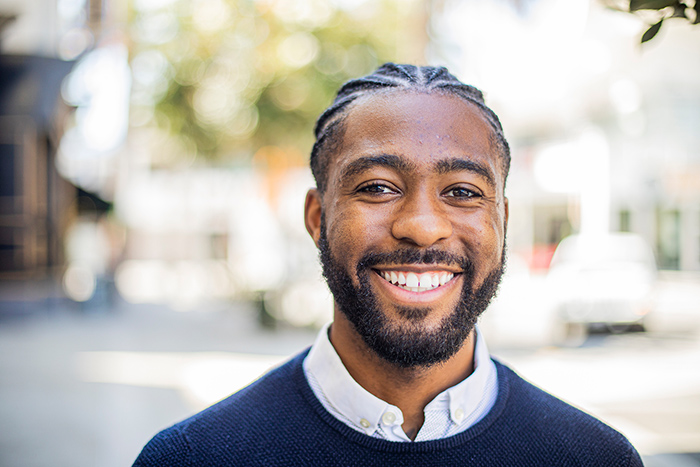 Outdoor headshot of smiling man 