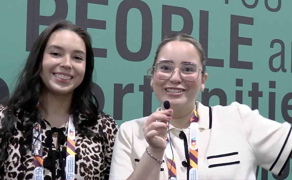 Two people talking about membership