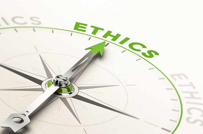 Compass with arrow pointing to the word ethics