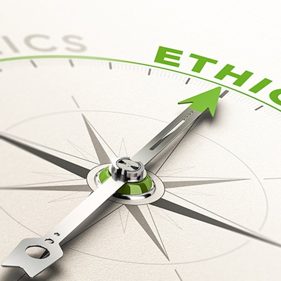 Compass with arrow pointing to the word ethics