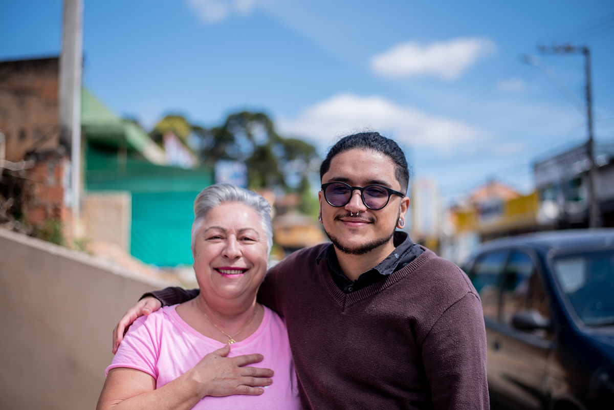 lgbtqia-mother-smiling-outside-with-transgender-son
