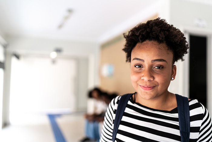 Smiling young female at home