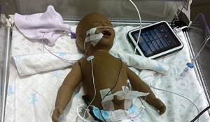 NICU infant simulated mannequin to teach positioning and handling techniques