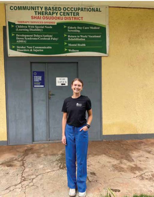 Shelby, first author, stands outside of the occupational therapy clinic in Dodowa.