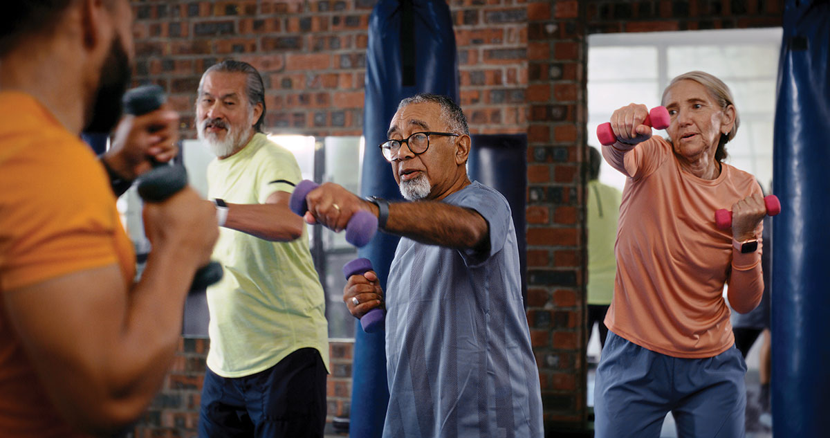 A group of older adults working out and lifting weights