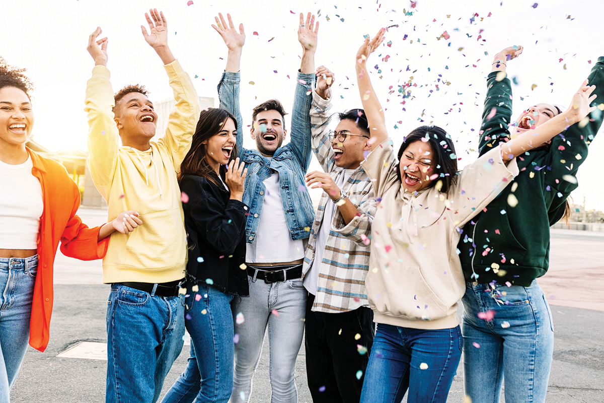 Group of people celebrating with confetti