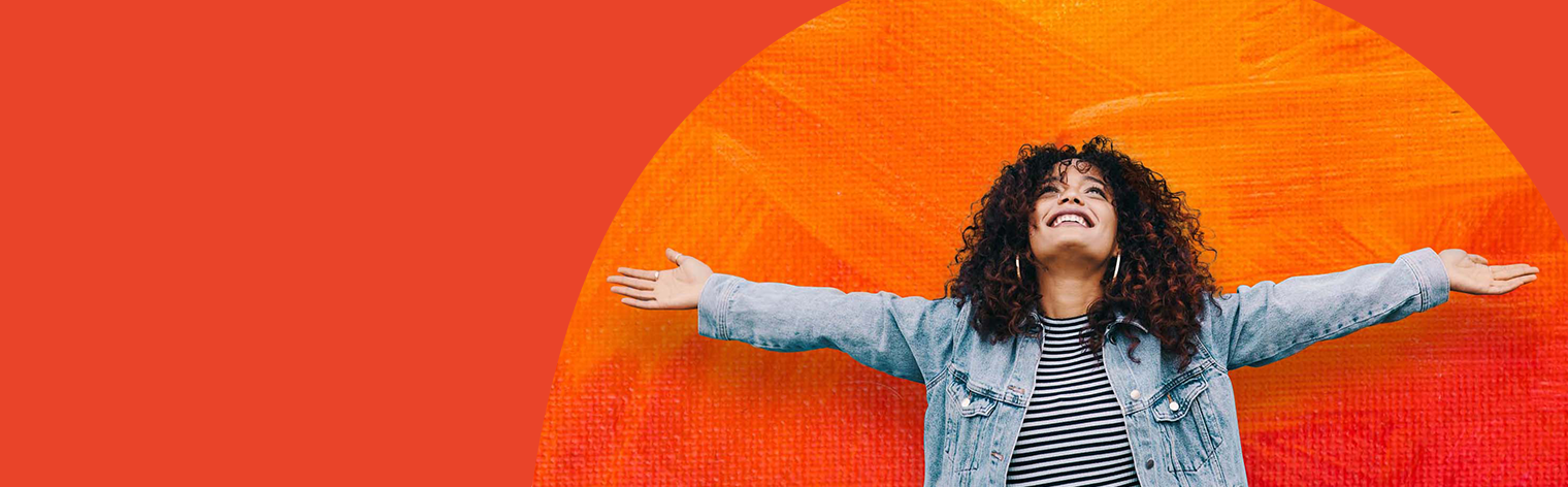 inspire: Woman celebrates with arms up.