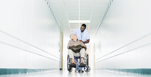 Man wheeled in wheelchair