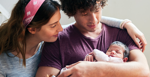 Parent couple with newborn-age child