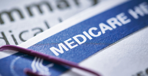 Image of top of Medicare form with purple paper clip.