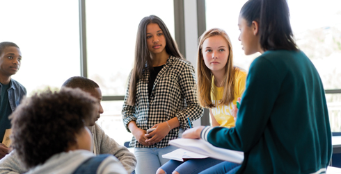 Adolescents talking in a group