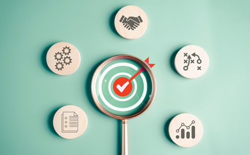 Bullseye with arrow and checkmark, along with five illustrations around it: handshake, gears, documents, and a chart.
