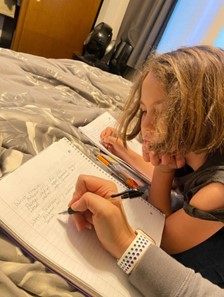 The author studies the structures of the hand for a biomechanics test with her daughter Maya (8) and her son Mathis (4)