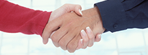 A closeup of two people shaking hands.